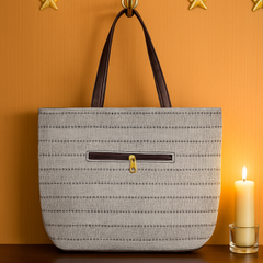 Elegant Beige Textured Handbag with Brown Handles