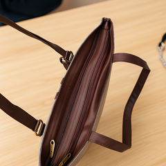 Elegant Beige Textured Handbag with Brown Handles