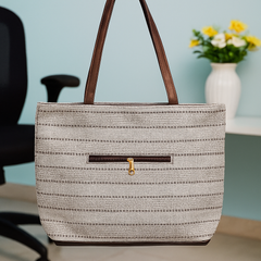 Elegant Beige Textured Handbag with Brown Handles