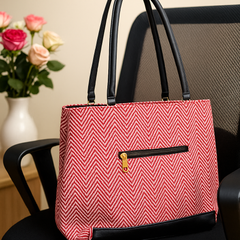 Stylish Pink Chevron Pattern Handbag with Black Accents