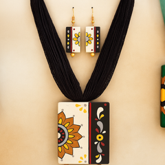 Handcrafted Sunflower Pendant Set – Yellow & Black Tribal Design