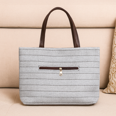 Elegant Beige Textured Handbag with Brown Handles